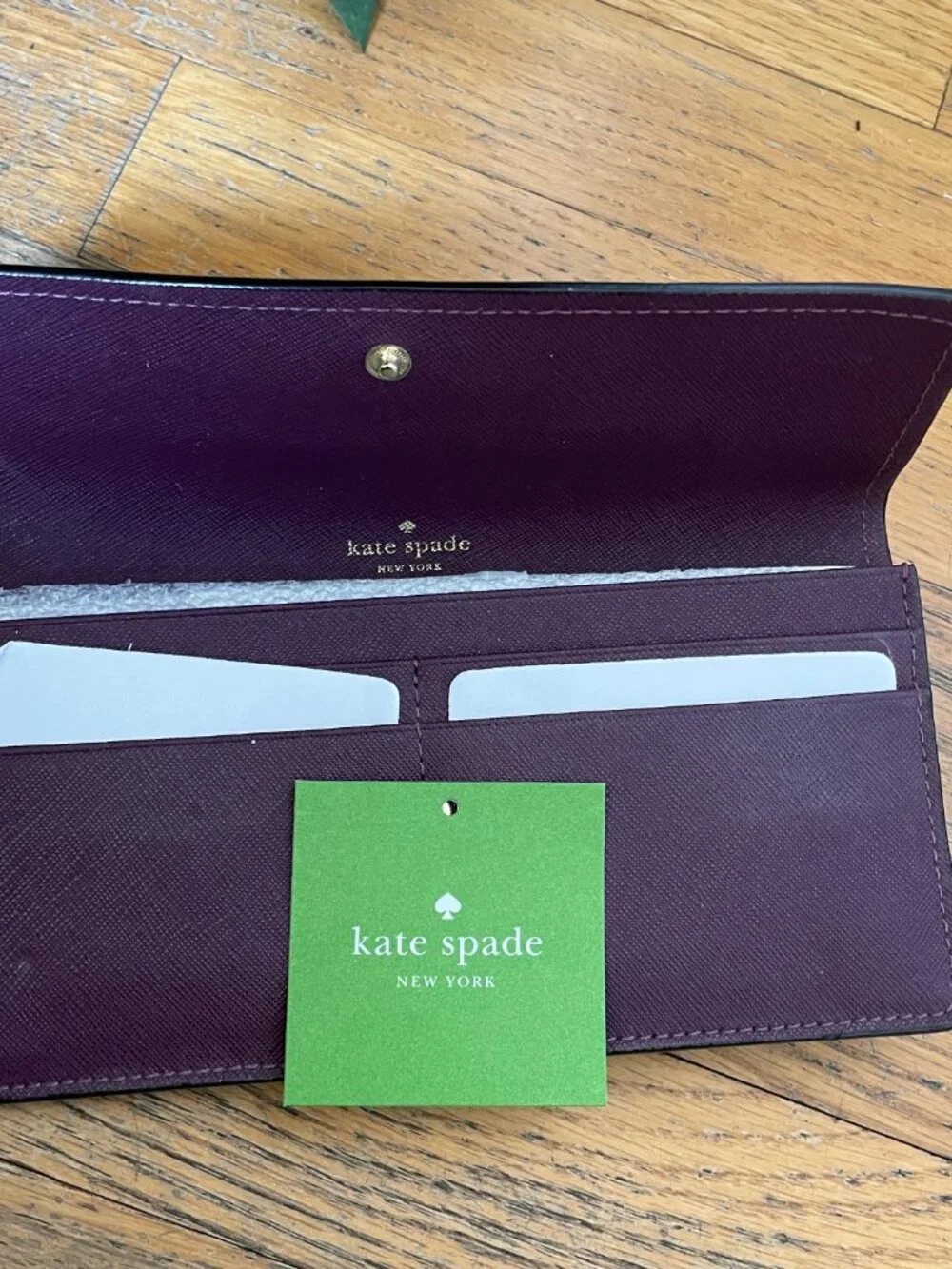 Kate Spade Large bi- Fold wallet in Deep Plum